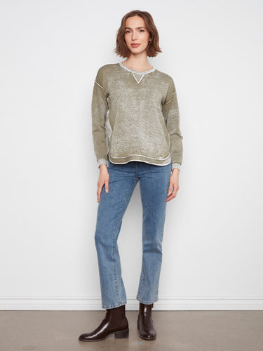 The sweater's drop shoulders create a relaxed silhouette, perfect for casual outings. By Charlie B.