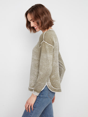 Designed with long sleeves, this piece ensures warmth and style in cooler weather. By Charlie B.