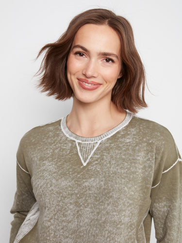 The washed finish gives this cotton sweater a unique texture and appearance. By Charlie B.
