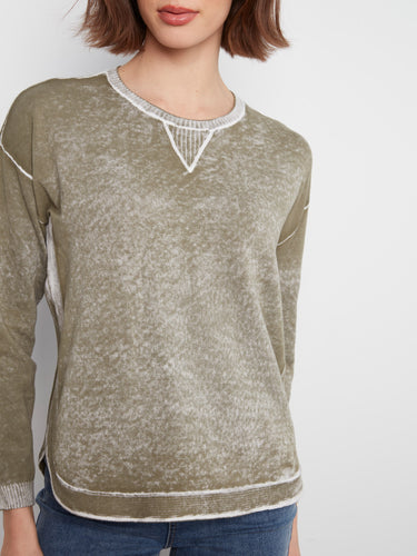 Crafted from 100% cotton, this garment promises softness and breathability throughout the day. By Charlie B.