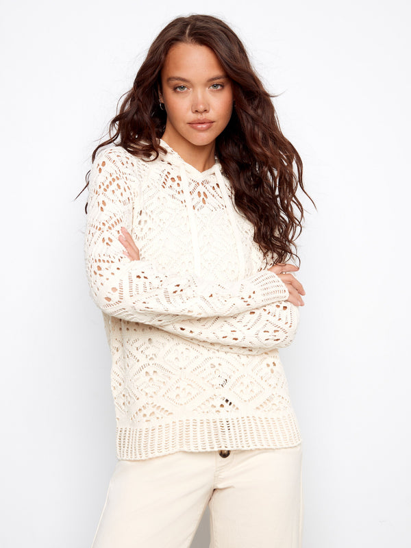 Elegant natural cotton crochet hoodie sweater showcasing long raglan sleeves and delicate open-knit details by Charlie B.