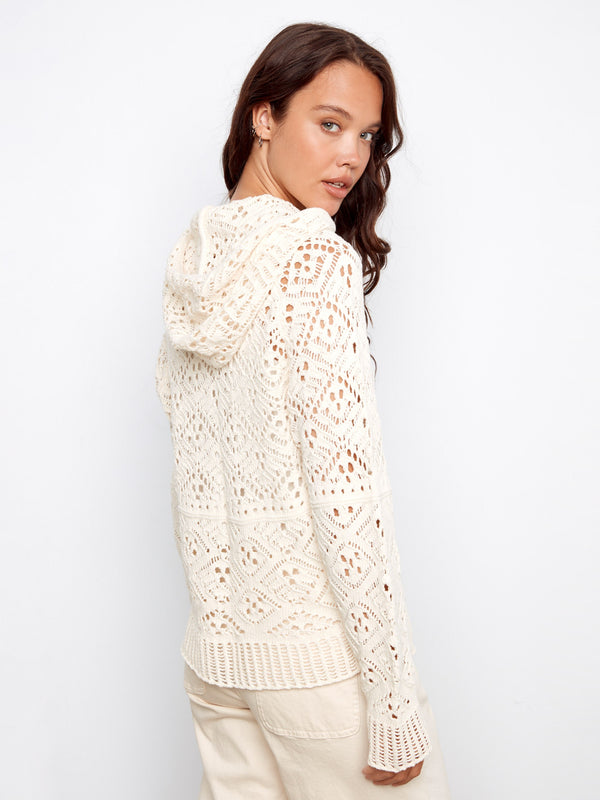 Intricate open-knit design on this natural cotton crochet hoodie sweater, crafted from 100% cotton for comfort by Charlie B.