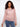 Elegant pink crochet sweater with raglan sleeves, providing a relaxed yet chic look. Designed in 100% cotton by Charlie B.