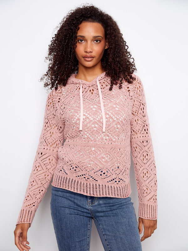 Elegant pink crochet sweater with raglan sleeves, providing a relaxed yet chic look. Designed in 100% cotton by Charlie B.