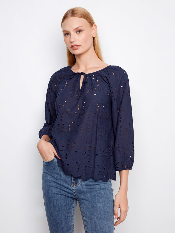 Blouse with a notched neckline and tie, featuring intricate eyelet detailing for a chic look by Charlie B.