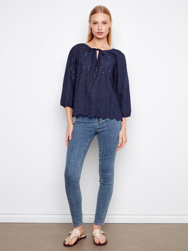 Elegant blouse showcasing 3/4 sleeves and delicate scalloped hem, perfect for any occasion by Charlie B.