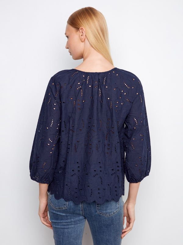 Chic blouse adorned with beautiful eyelet detailing, offering a sophisticated touch to your style by Charlie B.