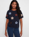Navy blue top with floral design, featuring a classic crew neck for a timeless look. Perfect for casual outings by Charlie B.