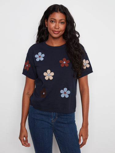 Navy blue top with floral design, featuring a classic crew neck for a timeless look. Perfect for casual outings by Charlie B.