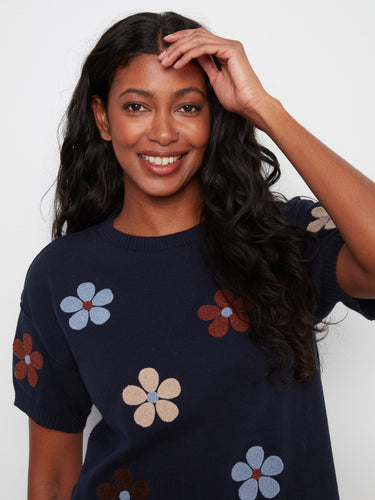 Charming navy blue top adorned with floral patterns, made from 100% cotton for ultimate comfort and breathability by Charlie B.
