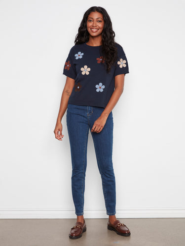 Stylish navy blue top with colorful floral accents and elbow sleeves, ideal for any relaxed occasion by Charlie B.