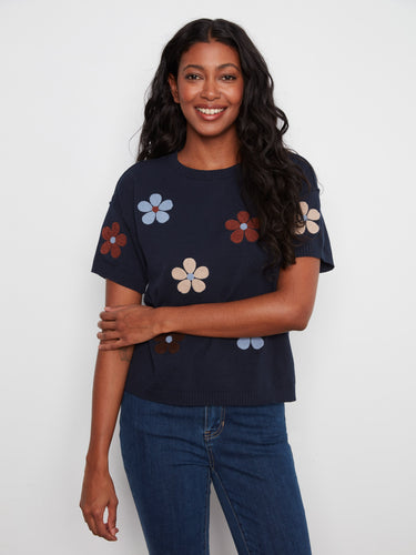 Elegant navy blue shirt showcasing a delightful flower motif, crafted entirely from soft cotton fabric by Charlie B.