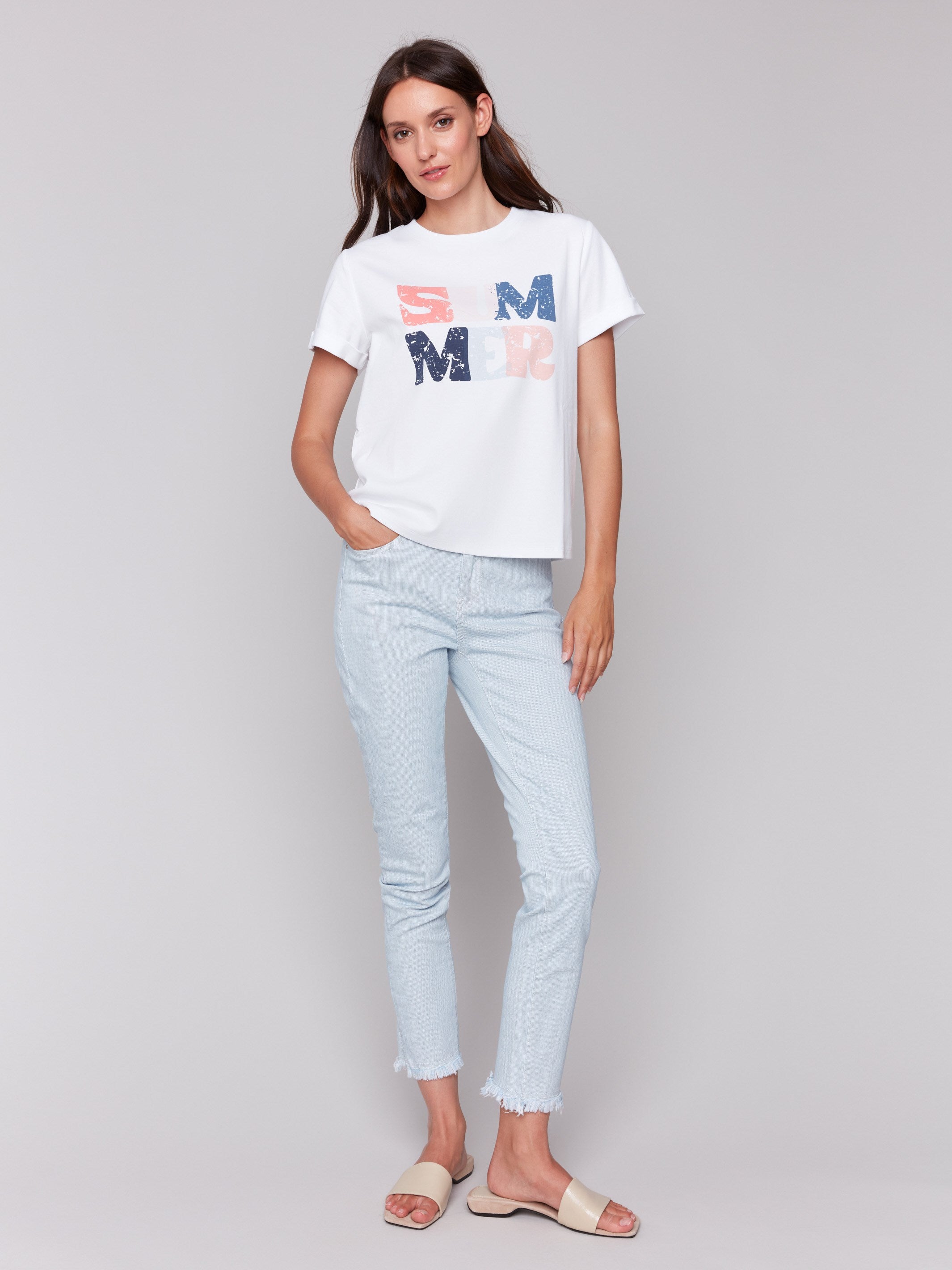 White tee featuring a crew neckline and vibrant design by Charlie B.