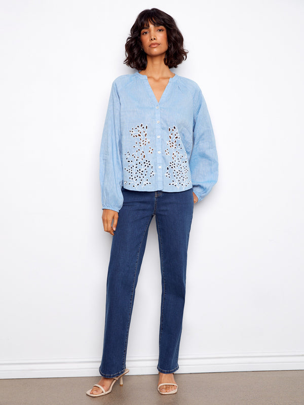 Stylish blouse showcasing long raglan sleeves and beautiful eyelet embroidery, perfect for any occasion by Charlie B.