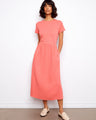 This dress features a classic crew neckline, offering a timeless look with its simple yet elegant design by Charlie B.