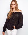 Black cotton blouse with elastic cuffs and lace-up front, featuring openwork trim by Charlie B.