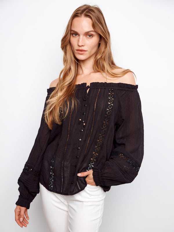 Black cotton blouse with elastic cuffs and lace-up front, featuring openwork trim by Charlie B.