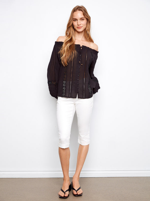 Semi-sheer black blouse with button-front details, off-the-shoulder style by Charlie B.