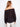 Elegant off-the-shoulder black blouse in semi-sheer cotton fabric by Charlie B.