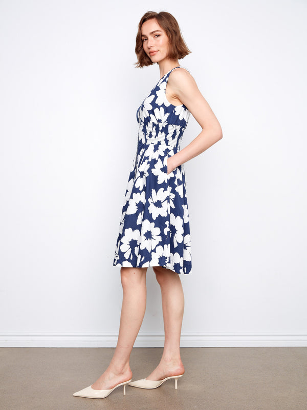 Stylish knee-length dress with hidden pockets for practicality and flair. By Charlie B.
