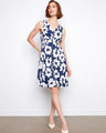 Classic knee-length floral dress designed with hidden pockets for added functionality. By Charlie B.