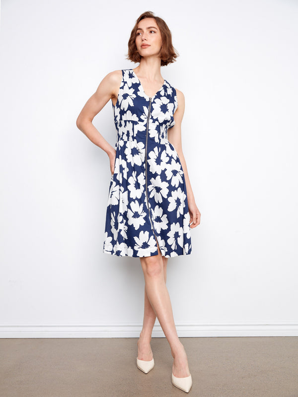 Classic knee-length floral dress designed with hidden pockets for added functionality. By Charlie B.