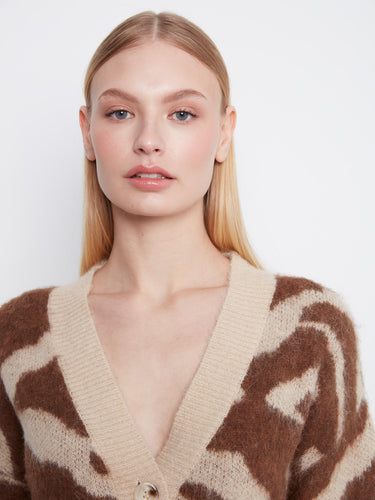 With its drop shoulder design, this stylish cardigan offers both comfort and contemporary flair in one piece. By Charlie B.