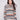 Autumn-hued sweater with a cozy cowl neck and intricate cable knit detailing, perfect for chilly days by Charlie B.