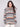 Autumn-hued sweater with a cozy cowl neck and intricate cable knit detailing, perfect for chilly days by Charlie B.