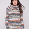 Autumn-hued sweater with a cozy cowl neck and intricate cable knit detailing, perfect for chilly days by Charlie B.