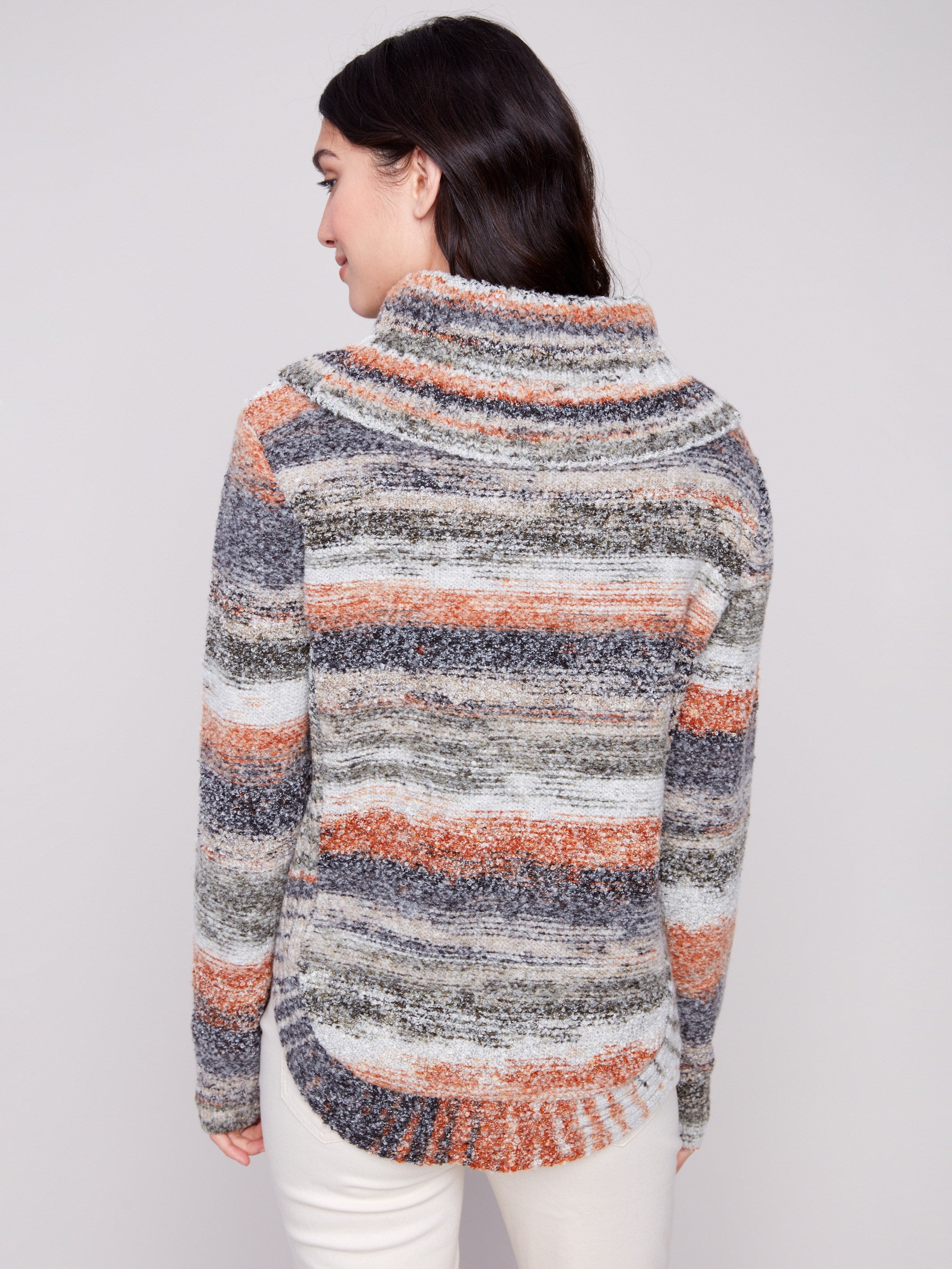 Stylish sweater showcasing a unique round hem design in earthy hues, offering both warmth and style by Charlie B.