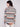 Stylish sweater showcasing a unique round hem design in earthy hues, offering both warmth and style by Charlie B.