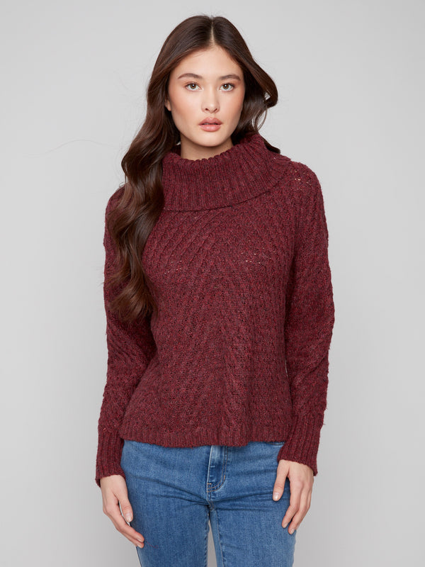 Cabernet sweater with a relaxed fit and diagonal cable knit, perfect for cozy days by Charlie B.