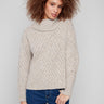 Heather Oat sweater with a cozy cowl neckline, featuring a diagonal cable knit design and ribbed cuffs by Charlie B.