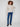 Oat-colored sweater showcasing a relaxed fit with intricate diagonal cable patterns and ribbed detailing by Charlie B.