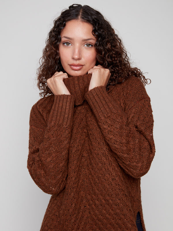 Embrace comfort with this sepia sweater's relaxed fit, offering both warmth and style for any casual outing by Charlie B.