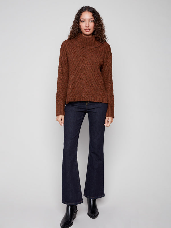 Experience ultimate coziness in this sepia cowl neck sweater, designed with a flattering relaxed fit by Charlie B.