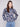 Navy blue sweater featuring dolman sleeves and a vibrant floral jacquard design, perfect for cozy elegance by Charlie B.