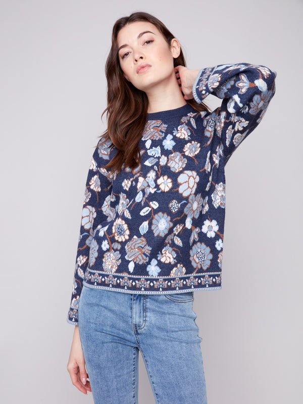 Stylish navy sweater with intricate floral jacquard pattern, complemented by classic crew neck style by Charlie B.