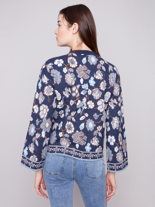 Floral jacquard navy sweater with relaxed dolman sleeves for effortless style and comfort by Charlie B.