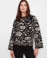 Floral-patterned sweater with a crew neckline, perfect for a chic and comfortable look. By Charlie B.