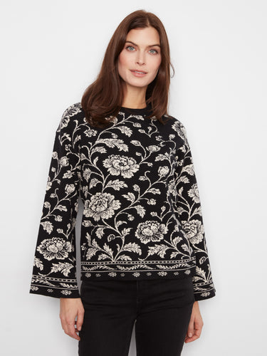 Chic floral design with drop shoulders enhances the casual yet elegant vibe of this top. By Charlie B.
