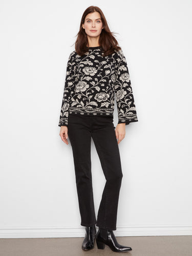 Crew neckline complements the intricate floral pattern on this stylishly relaxed sweater. By Charlie B.