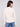 Soft oat sweater with drop shoulders and intricate sleeve design, offering both comfort and style by Charlie B.