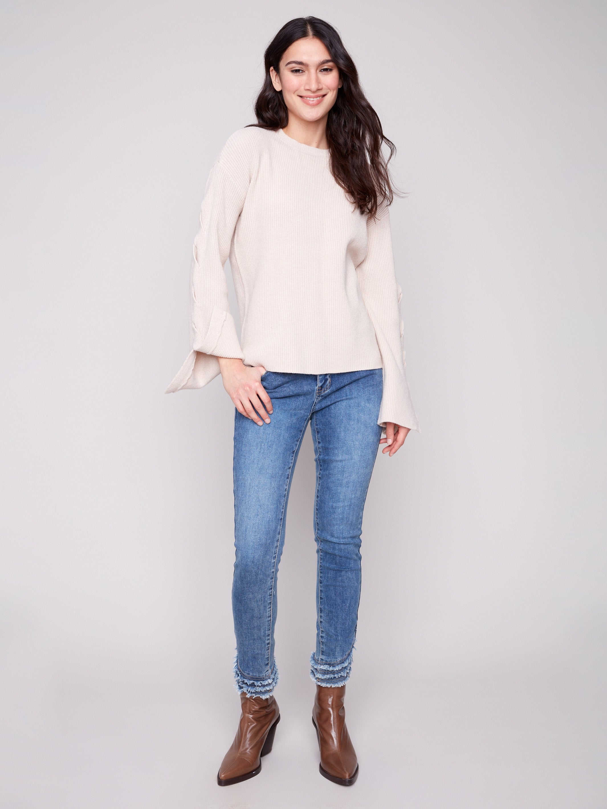 Heather oat sweater with a classic crew neckline and charming sleeve accents for a fashionable ensemble by Charlie B.