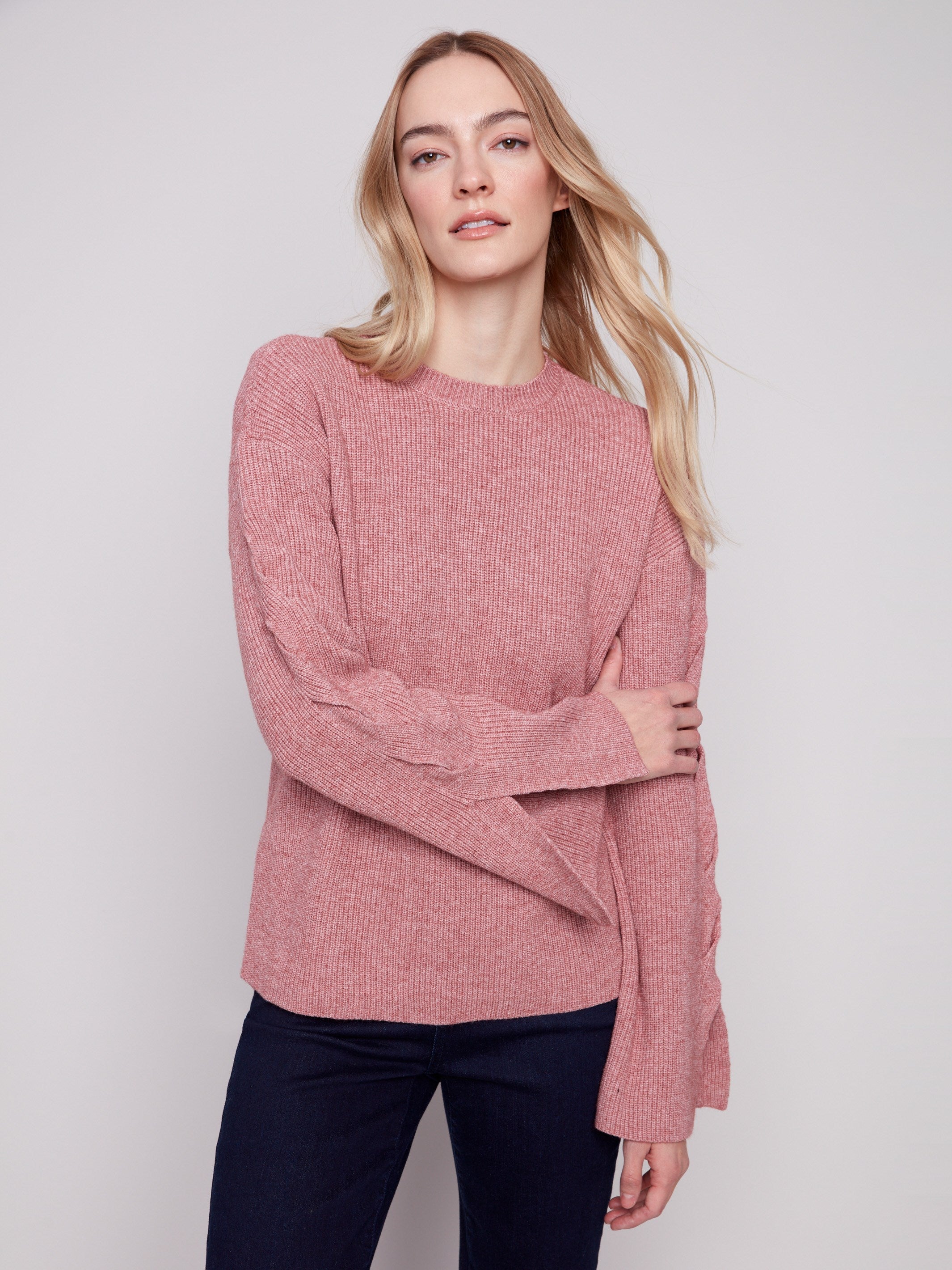 Sweater in heather primrose with elegant cable detail on sleeves, adding flair by Charlie B.