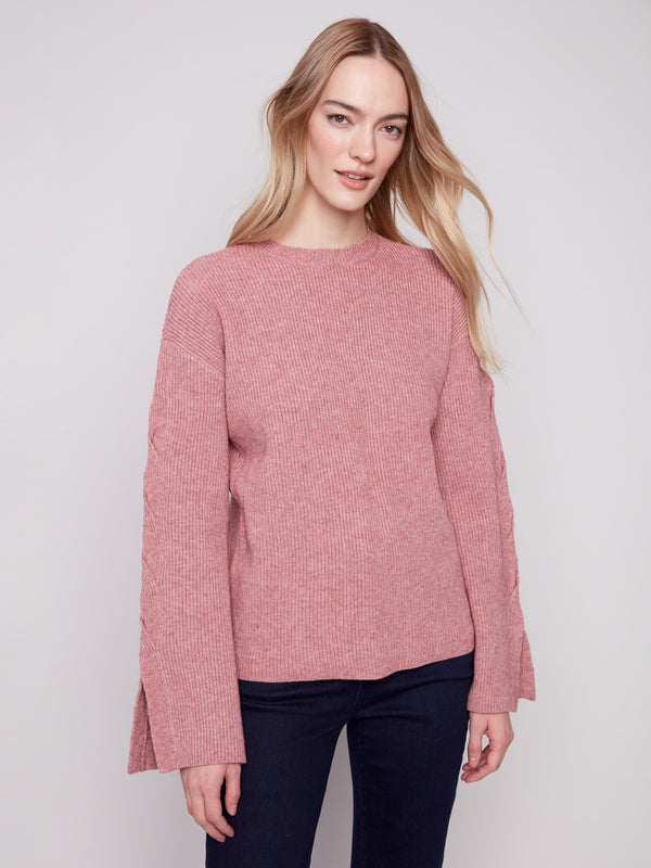 Elegant cable sleeve detailing on this comfortable heather primrose sweater by Charlie B.