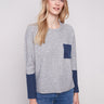 Heather grey sweater featuring a classic crew neck design and navy accents adds a stylish touch to any outfit by Charlie B.