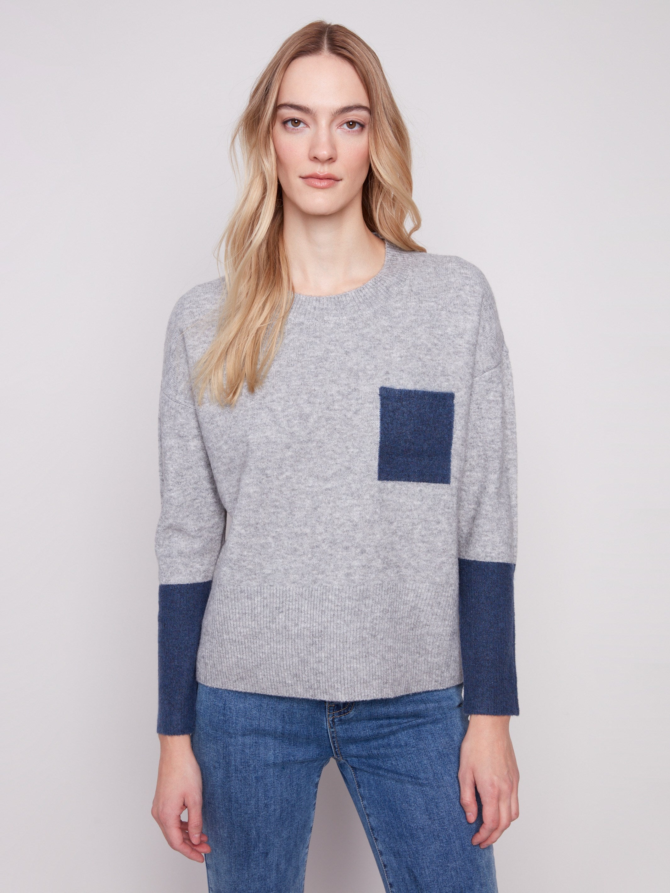 Heather grey pullover with distinctive contrast chest pocket, blending modern style with cozy warmth by Charlie B.