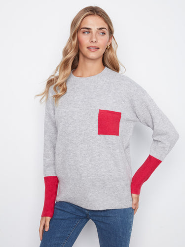 Long sleeves in contrasting colors add a modern twist to this versatile sweater, making it a standout piece in your wardrobe by Charlie B.